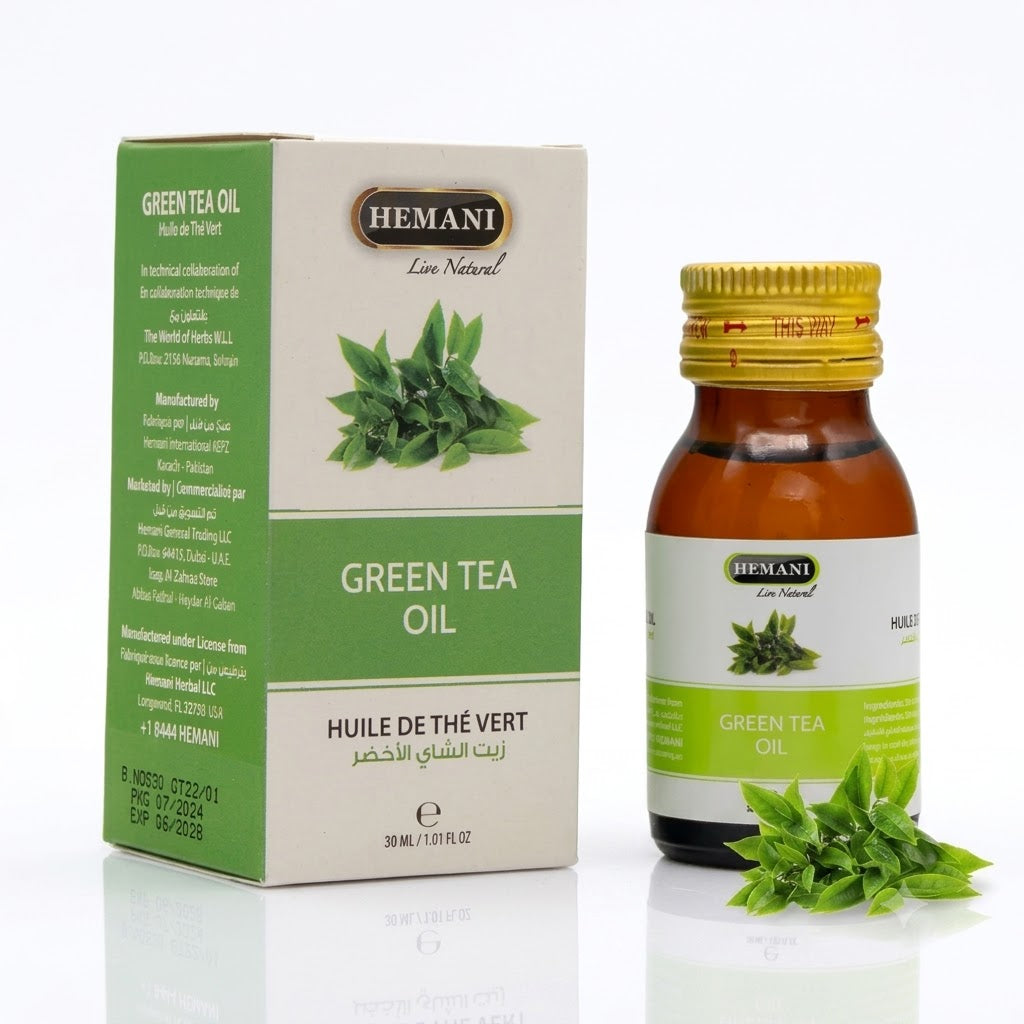 Hemani green tea oil packaging with bottle and box on a white background