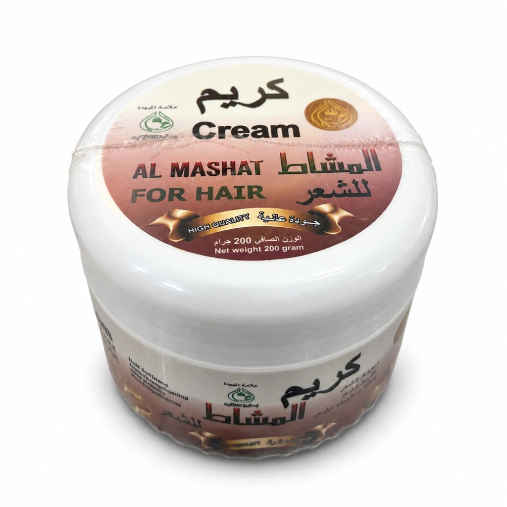 A white jar of Al Mashat Cream for Hair, featuring a brown and beige label with Arabic and English text, set against a plain white background.