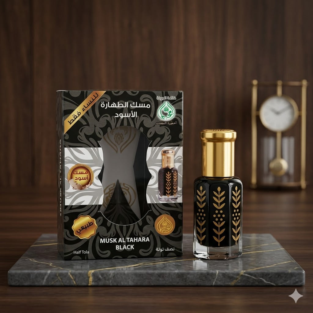 Musk Al Tahara Black perfume bottle and packaging on a marble surface with a wooden background.