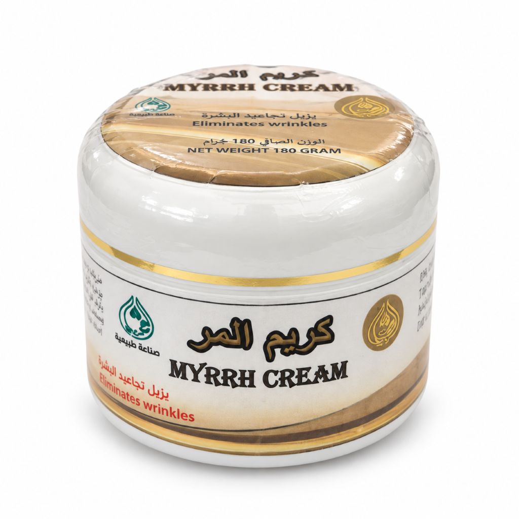 A white plastic jar of MYRRH CREAM with a gold and beige label, featuring Arabic and English text, on a clean white background.