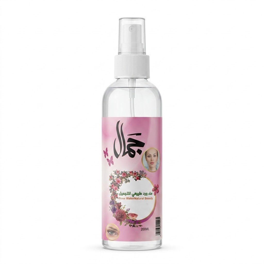Clear spray bottle of Natural Rose Water with a pink label featuring Arabic text and floral designs on a white background.