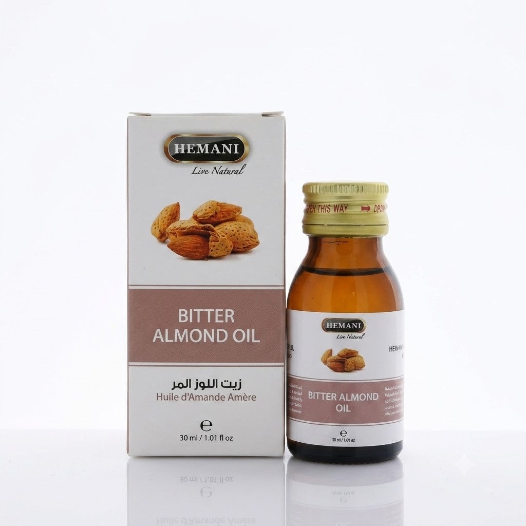 Bitter almond oil bottle and packaging with 'Hemani' branding on a white background