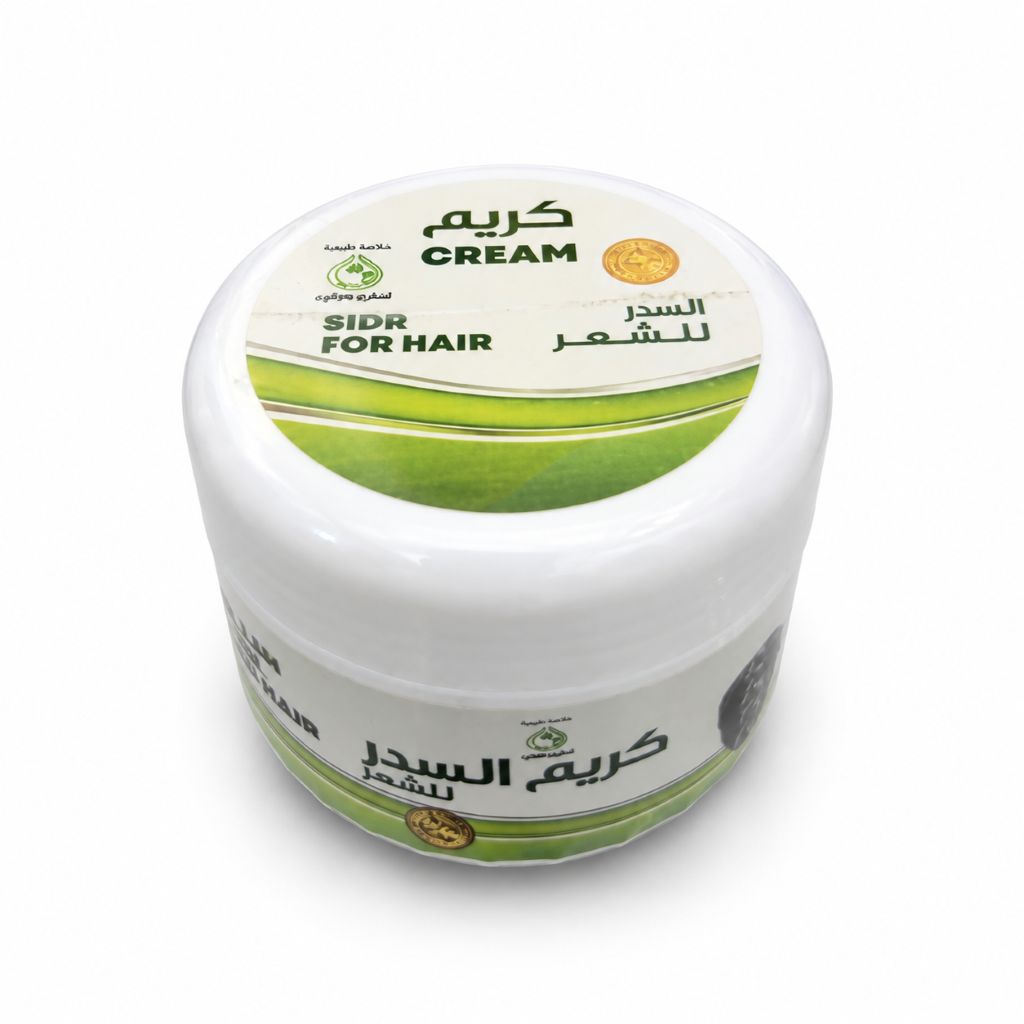 A white plastic jar of Sidr Cream for Hair, featuring a white lid with green and black text and a gold circular emblem, set against a plain white background.
