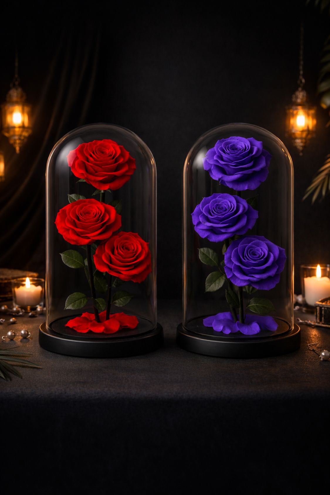 Two glass domes with red and purple roses on a dark background