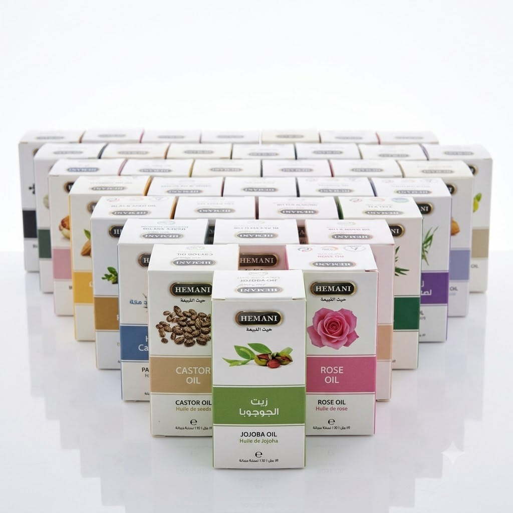 Row of HEMANI essential oil boxes on a white background