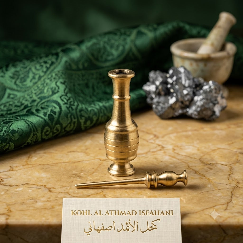 Gold cosmetic applicator with a card displaying 'Kohl Al Athmad Isfahani' on a wooden surface.