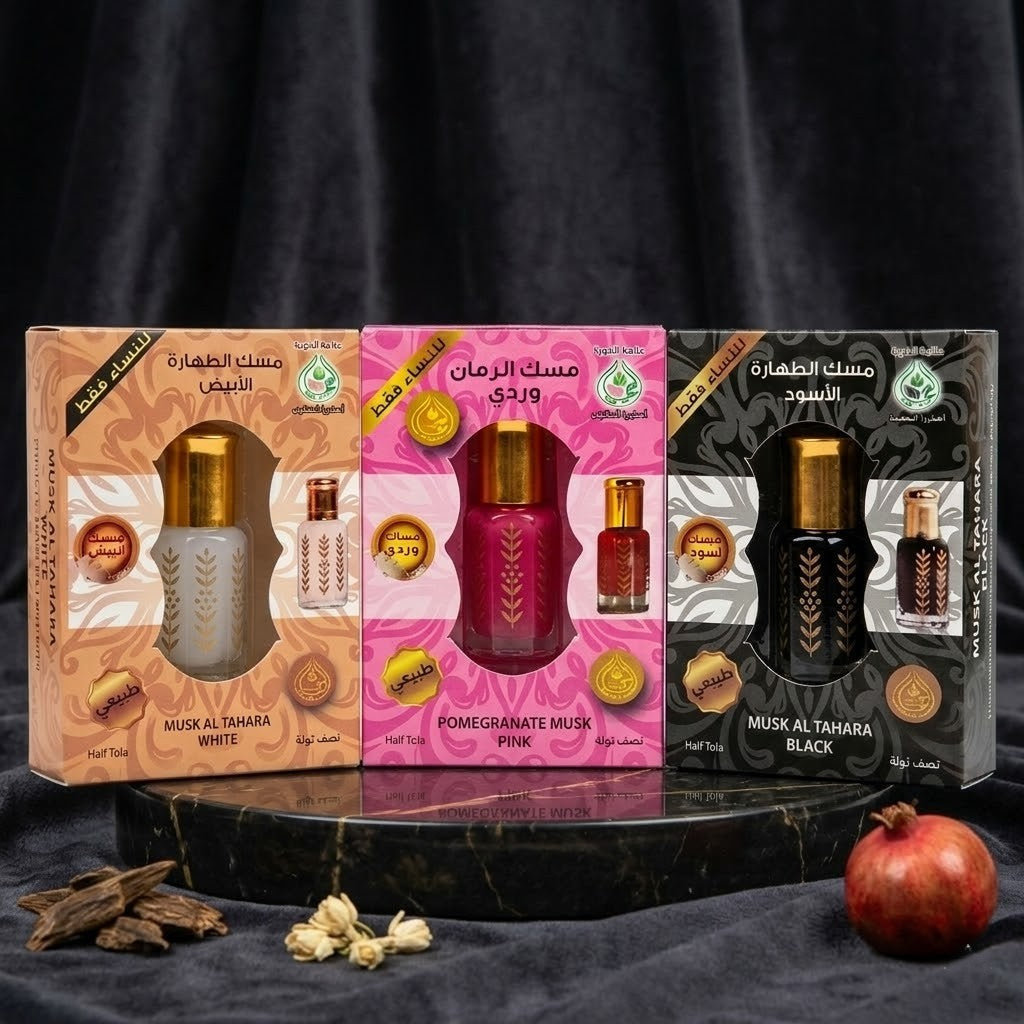 Three boxes of different scents of Musl Al Tahara on a dark background with pomegranate and rose petals.