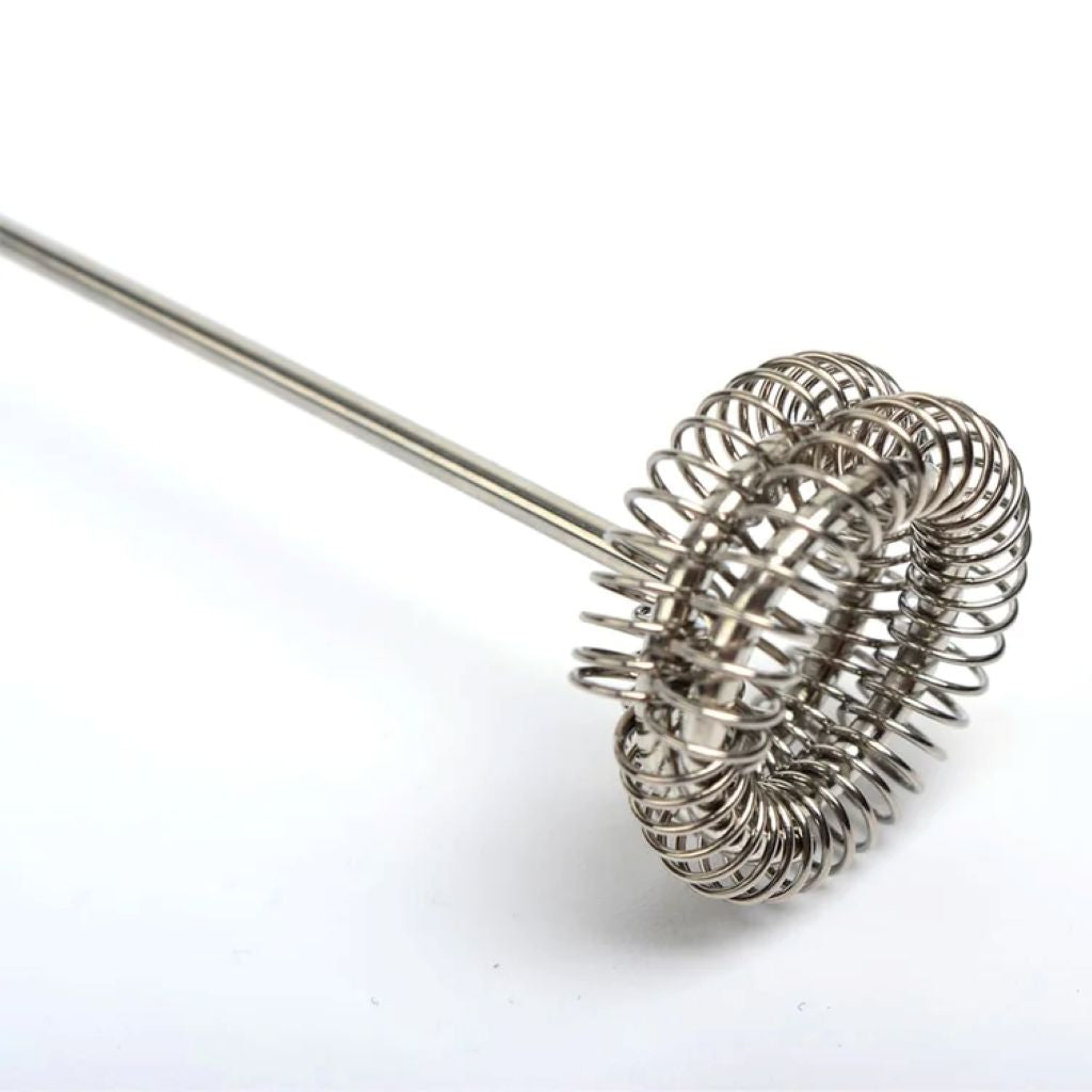 Metallic whisk on a white background